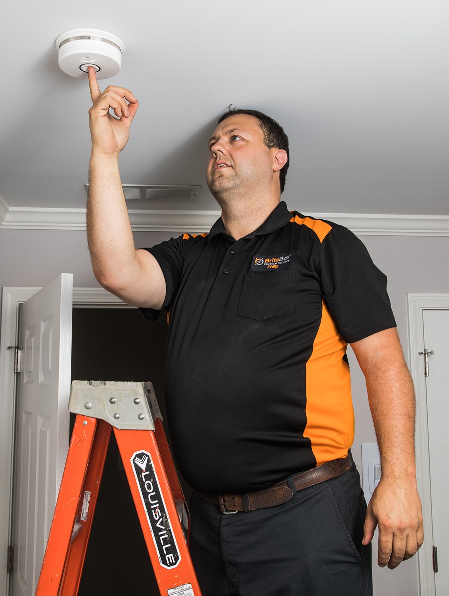 Electrician Installing Smoke Detector