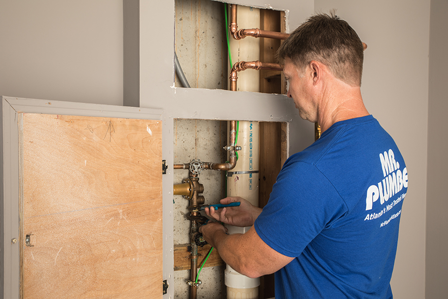 Technician fixing water line